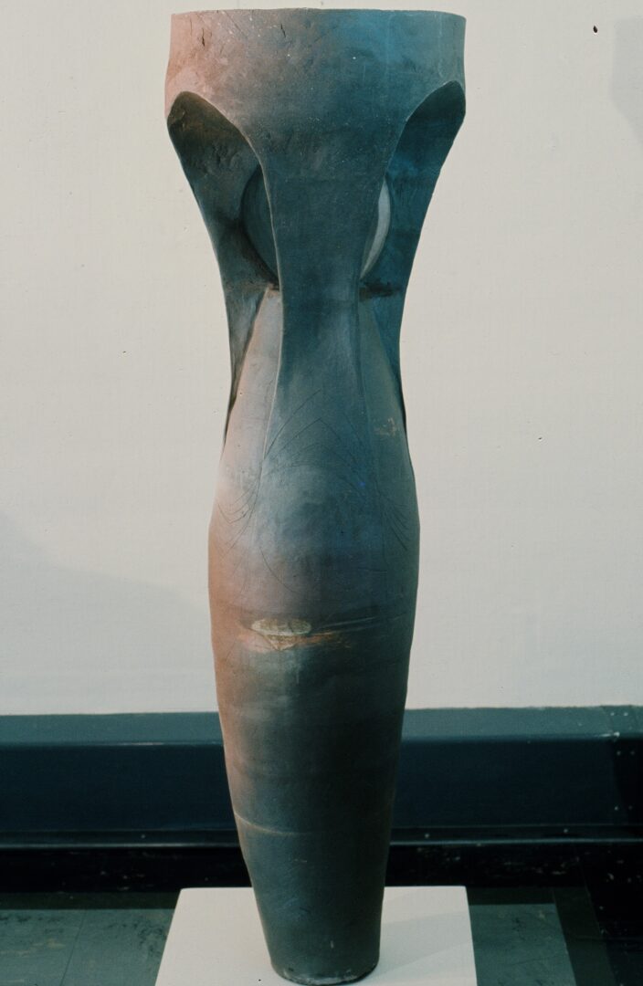 A tall gray sculpture